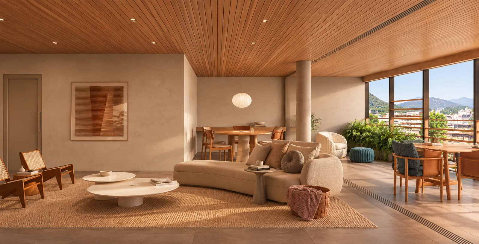 Sala ampla com sofá curvo, mesa de jantar e a varanda integrada