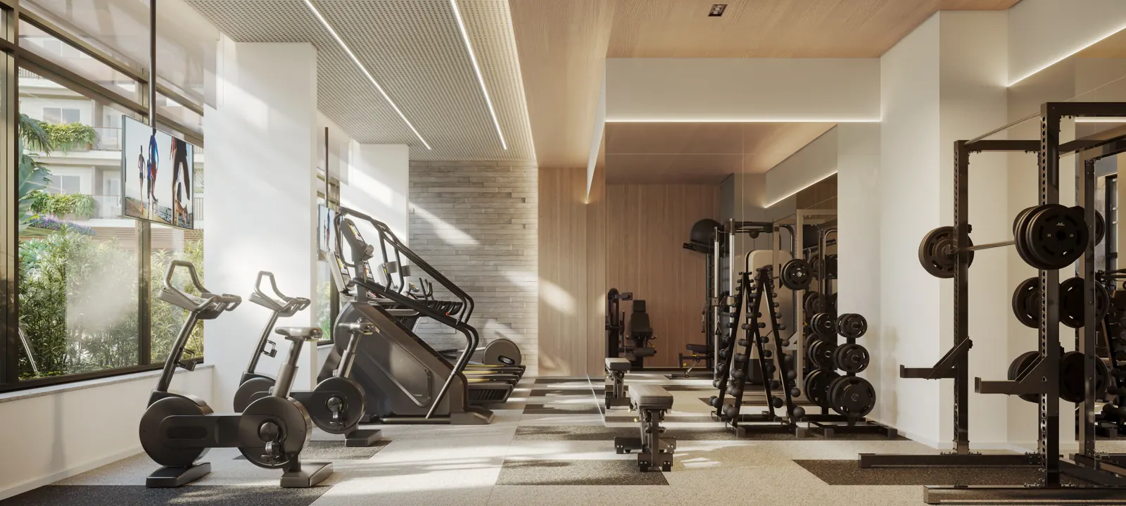 Espaço fitness com esteiras, bicicletas e aparelhos de musculação