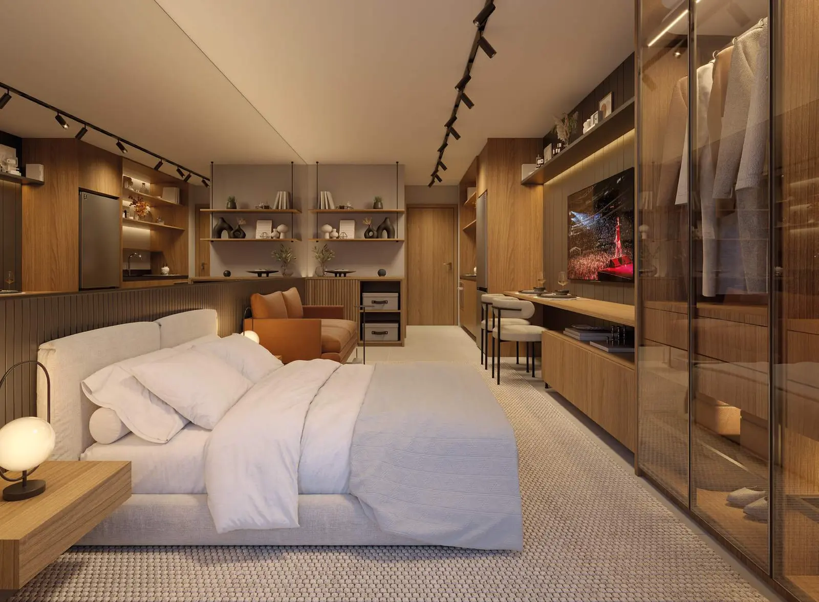 Studio decorado com cama de casal, marcenaria em madeira e cozinha integrada