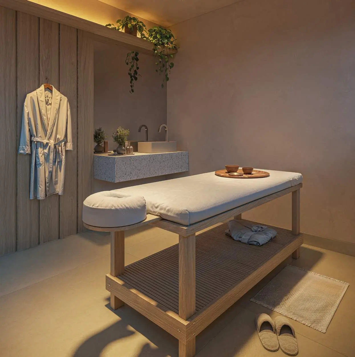 Sala de massagem com maca, roupão pendurado e plantas