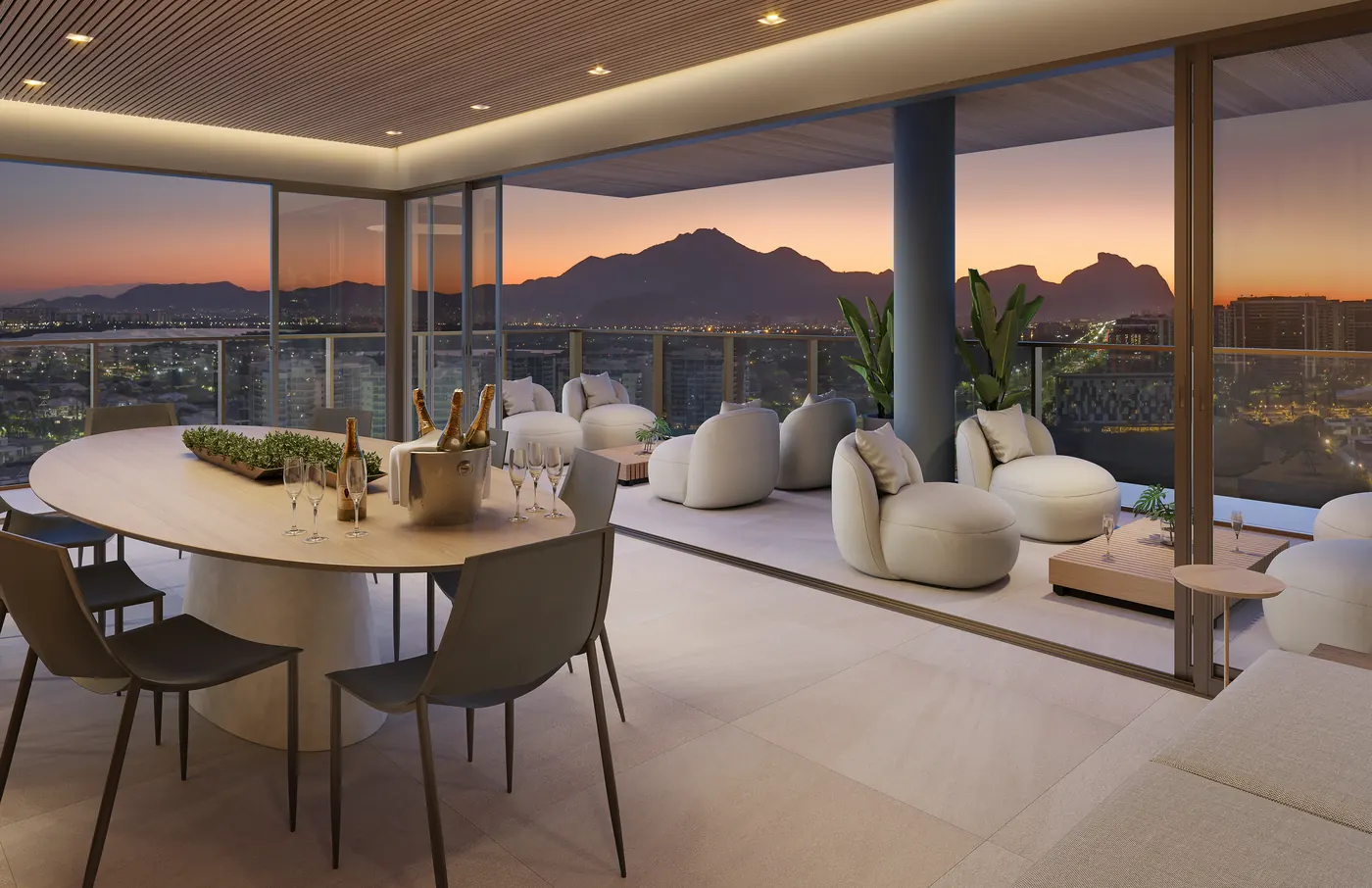 Perspectiva do espaço gourmet no rooftop, com vista para as montanhas no fim da tarde