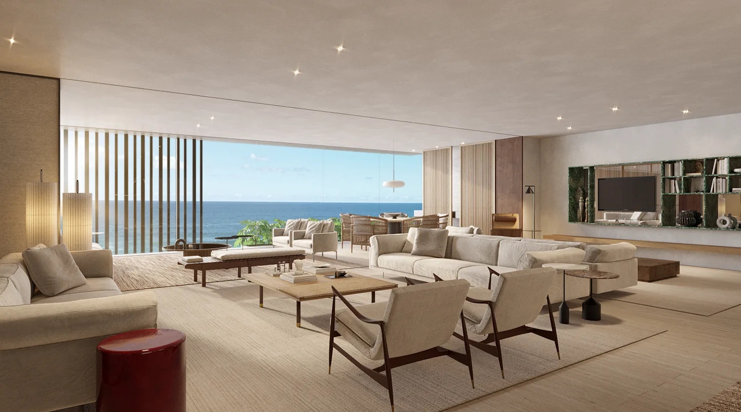 Living do apartamento, com poltronas e o mar pela janela